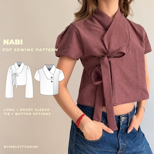Puede incluir: Una blusa cruzada de color malva con mangas cortas y cierre de lazo lateral. La imagen incluye el texto NABI PDF SEWING PATTERN, mostrando dibujos lineales de versiones de manga larga y corta con opciones de lazo y botones, y la marca BYMELCITTADINI.