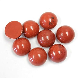 May include: Eight red gemstone cabochons, each with a smooth, polished surface. The cabochons are round and have a slightly domed shape.