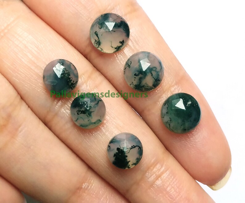 May include: Five round, faceted, moss agate cabochons in shades of green and white. The stones are approximately 10mm in diameter.