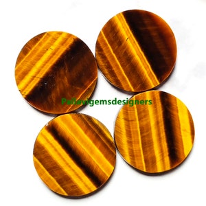 May include: Four round, polished tiger's eye cabochons. The stones are a rich golden brown color with dark brown stripes.