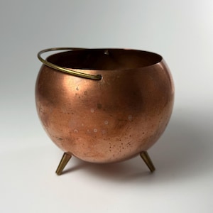 May include: A set of three ceramic mugs with a speckled, matte finish. The mugs are in shades of cream, light gray, and dark gray. Each mug has a simple, minimalist design, perfect for coffee or tea.