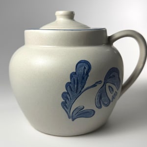 May include: A rustic wooden sign with the text "Welcome to our home" in white lettering. The sign features a distressed finish and a simple, inviting design, perfect for a front porch or entryway.