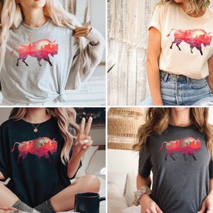 May include: Four different models wearing a t-shirt with a graphic of a red and orange silhouette of a bison with a sunset and trees inside the silhouette.