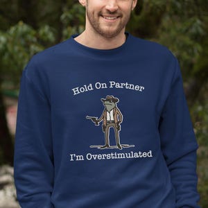Hold On Partner Im Overstimulated Shirt, Cowboy Frog Sweatshirt, Unhinged Tshirt, Weirdcore Outfits, Gen Z Sweater, Funny Meme Hoodie Tee, Cowgirl Frog Women Sweatshirts, Western Frogs Girl Party Hoodies, Frog Gun Vacation Shirts,Holiday Cowgirls Tee