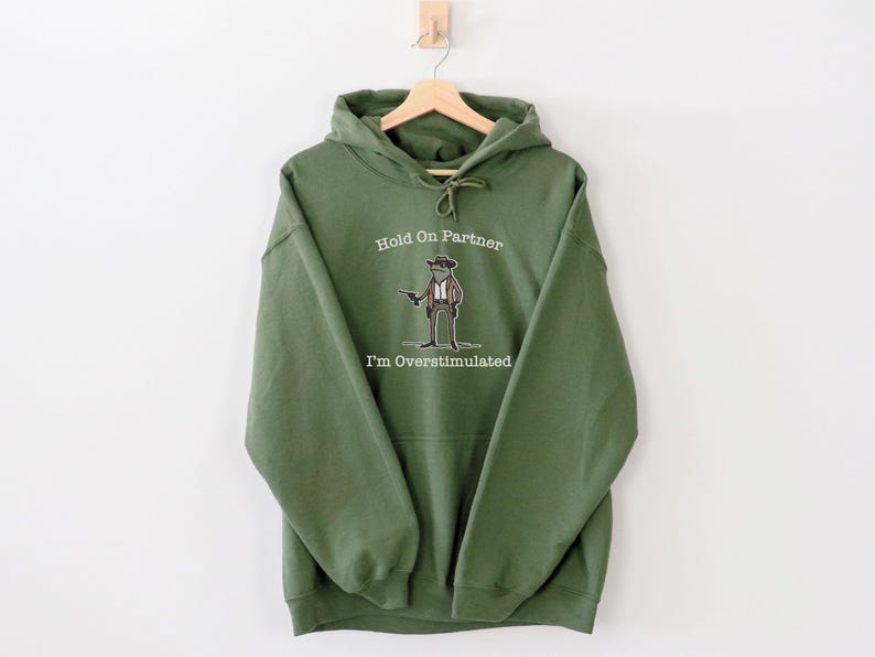 Hold On Partner Im Overstimulated Shirt, Cowboy Frog Sweatshirt, Unhinged Tshirt, Weirdcore Outfits, Gen Z Sweater, Funny Meme Hoodie Tee, Cowgirl Frog Women Sweatshirts, Western Frogs Girl Party Hoodies, Frog Gun Vacation Shirts,Holiday Cowgirls Tee