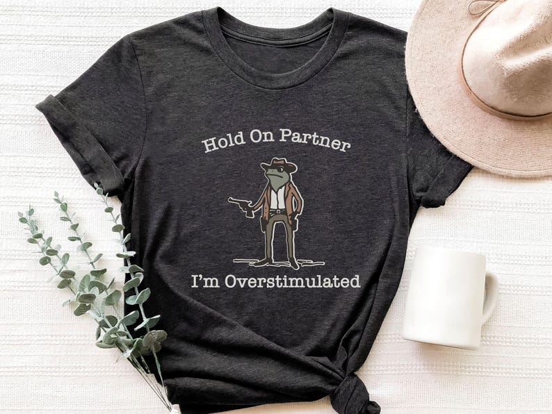 Hold On Partner Im Overstimulated Shirt, Cowboy Frog Sweatshirt, Unhinged Tshirt, Weirdcore Outfits, Gen Z Sweater, Funny Meme Hoodie Tee, Cowgirl Frog Women Sweatshirts, Western Frogs Girl Party Hoodies, Frog Gun Vacation Shirts,Holiday Cowgirls Tee