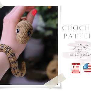 Op de afbeelding: Haakpatroon voor een bruin en zwart slangen amigurumi speelgoed. Het patroon is beschikbaar als PDF-download in het Engels.