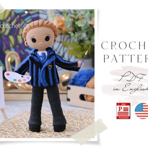 May include: Crochet pattern for a boy doll wearing a blue and black striped jacket, black pants, and holding a paintbrush and a palette. The pattern is available in PDF format and is written in English. The image also includes a US flag.