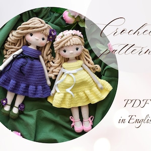 May include: Crochet pattern PDF in English for two amigurumi dolls. One doll wears a purple dress and the other wears a yellow dress. Both dolls have long blonde hair.