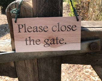 Wooden sign-'Please close the gate'
