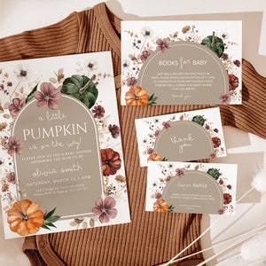May include: A set of four printable cards for a baby shower. The cards feature a watercolour design with pumpkins, flowers, and leaves in shades of orange, green, and pink. The text on the cards reads "Books for Baby", "Thank You", "Diaper Raffle", and "A Little Pumpkin is on the Way!"