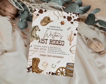 May include: A white invitation with brown text and illustrations for a 1st rodeo party. The invitation features a cowboy hat, a horse, a cactus, a horseshoe, a boot, a lasso, and a wagon wheel. The text reads "Saddle Up & Ride On Over For Weston's 1st Rodeo".