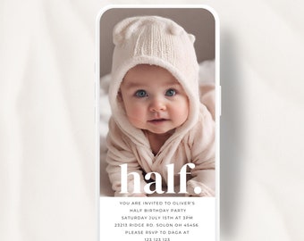 May include: A white and pink animated birthday invitation for a baby's half birthday party. The invitation features a photo of a baby wearing a white hooded sweater and a white hat. The text on the invitation reads "half."  "You are invited to Oliver's Half Birthday Party Saturday July 15th at 3pm 23213 Ridge Rd. Solon OH 45456 Please RSVP to Daga at 123 123 123"