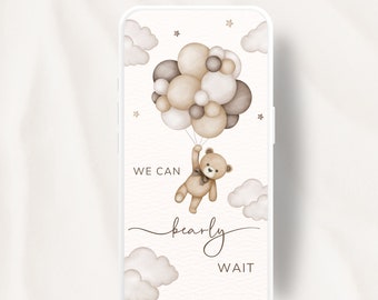 May include: A digital invitation for a baby shower with a cartoon teddy bear holding onto a bunch of brown and beige balloons. The text reads "We can barely wait".