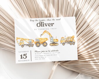 May include: Construction themed birthday party invitation with a yellow excavator, a yellow dump truck, a yellow crane, and a yellow cement mixer. The invitation says "Stop the traffic, close the road Oliver is turning two!" and includes the date "Saturday, November 15th".