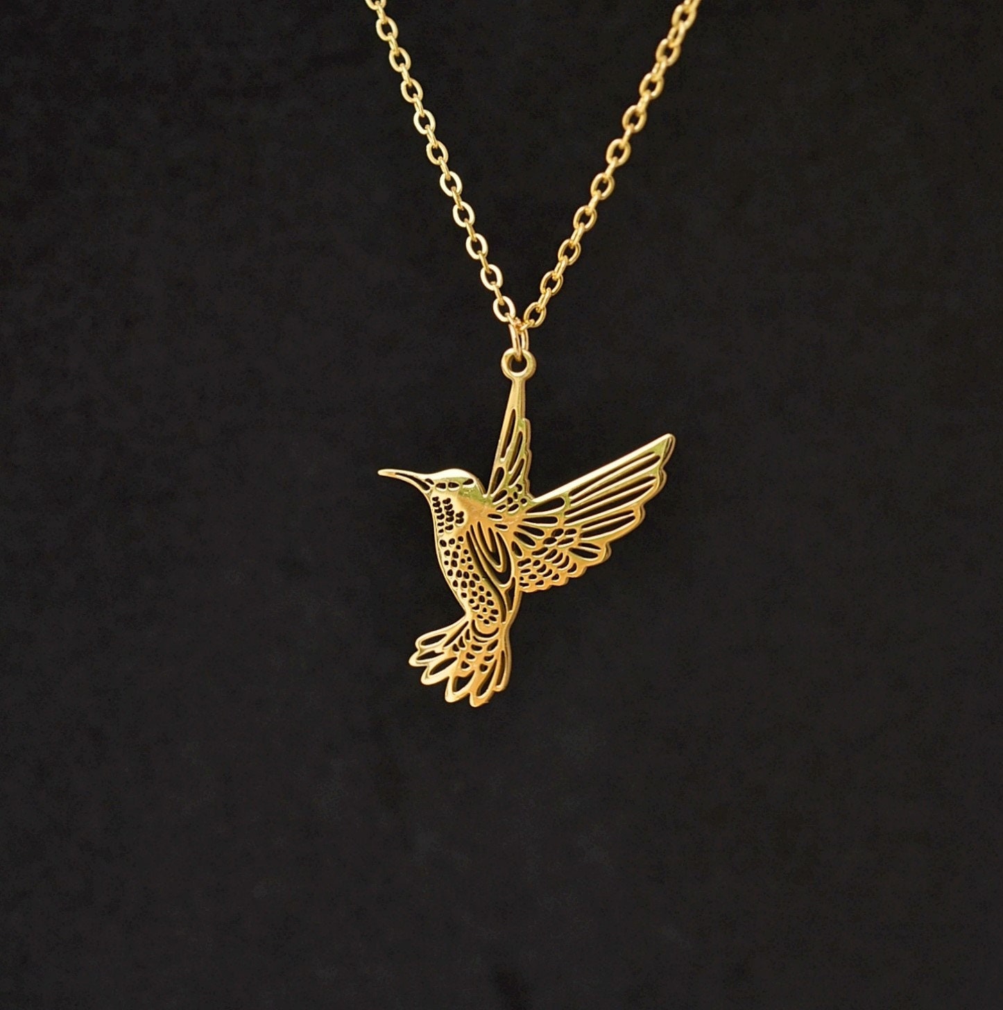 Gold store hummingbird pendant