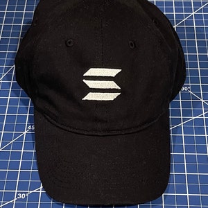 May include: A black baseball cap with a white embroidered logo of three parallel lines.