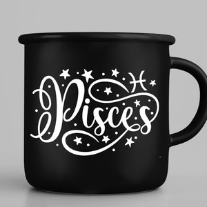 May include: Black ceramic mug with a white design of the zodiac sign Pisces with stars and the symbol for Pisces. The mug has a white handle.