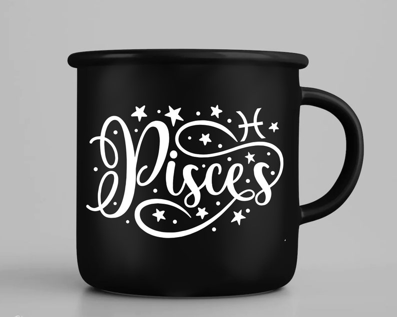 May include: Black ceramic mug with a white design of the zodiac sign Pisces with stars and the symbol for Pisces. The mug has a white handle.