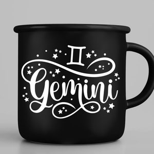 May include: Black enamel mug with a white design of the Gemini zodiac symbol and the word "Gemini" in a stylized font. The design is surrounded by small white stars.