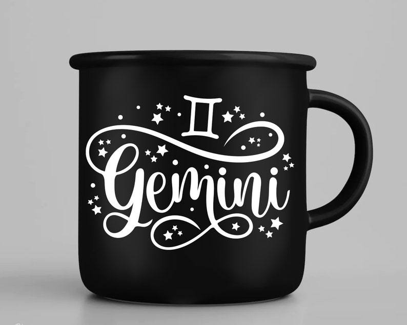 May include: Black enamel mug with a white design of the Gemini zodiac symbol and the word "Gemini" in a stylized font. The design is surrounded by small white stars.