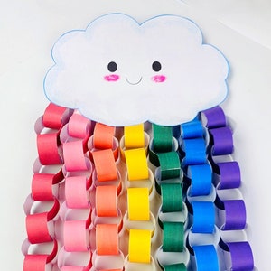 May include: A paper chain rainbow craft with a smiling cloud at the top. The rainbow is made of red, pink, orange, yellow, green, blue, and purple paper rings.