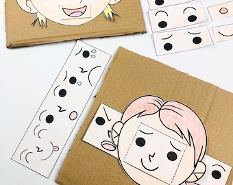 May include: Two cardboard pieces with cutouts of faces. The faces have blank spaces for eyes, mouths, and eyebrows. There are separate pieces with different expressions for the eyes, mouths, and eyebrows that can be placed in the cutouts.