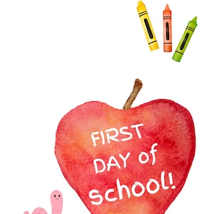 May include: A red apple with the words "FIRST DAY of SCHOOL!" written on it. There are three crayons above the apple, one yellow, one orange, and one green. A pink worm with a smiling face is to the left of the apple.
