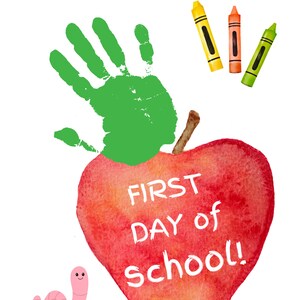 May include: A red apple with the words "FIRST DAY of SCHOOL!" written on it. A green handprint is on top of the apple. There are three crayons in the top right corner of the image. A pink worm is in the bottom left corner of the image.