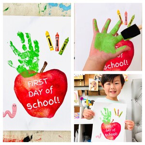 May include: A red apple with a green handprint on top and the words "FIRST DAY of SCHOOL!" written on it. A small pink worm is on the bottom left of the image.