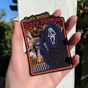 The Scream Movie Inspired “Let’s Watch Scary Movies” Ghostface Killah Halloweentown Poster Design Iron-On/Sew-On Embroidered Patch