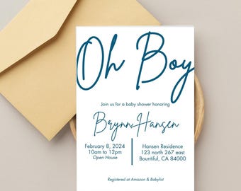 Könnte beinhalten: Eine Babyparty-Einladung mit den Worten "Oh Boy" in türkisfarbener Schrift. Die Einladung enthält Details für Brynn Hansens Babyparty, einschließlich Datum, Uhrzeit und Ort. Ein beigefarbener Umschlag befindet sich im Hintergrund.