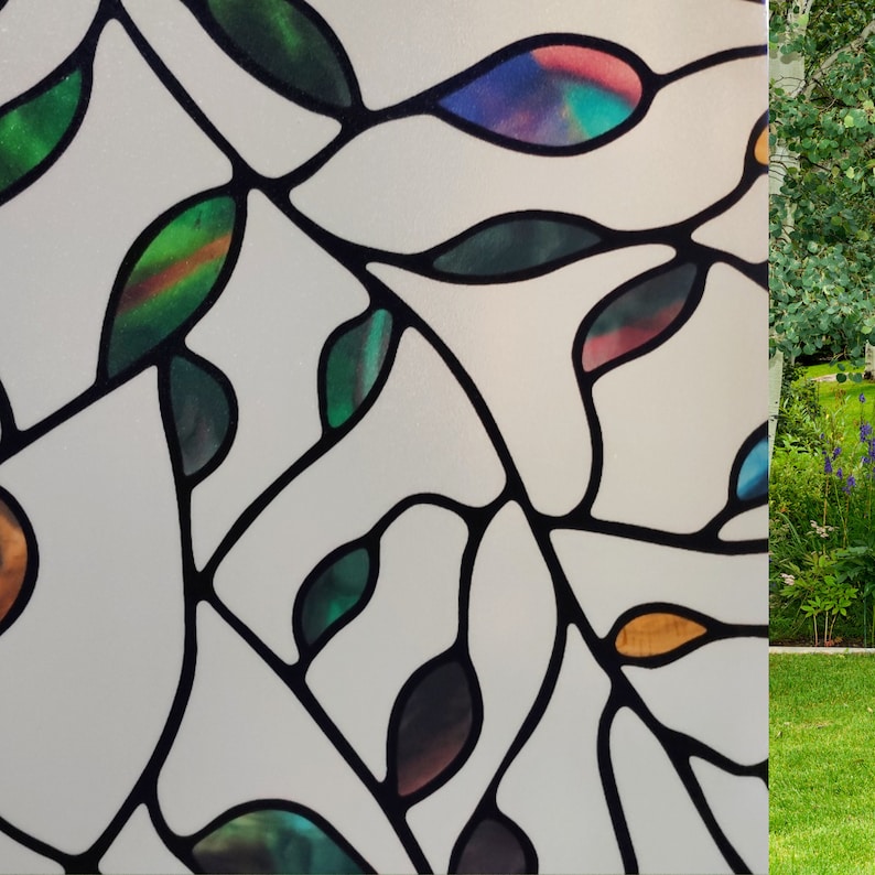 May include: A stained glass window film with a design of leaves and branches in shades of green, blue, and red.