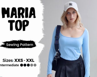 May include: A sewing pattern for a "MARIA TOP" in sizes XXS-XXL. The pattern is for an intermediate skill level. The image shows a model wearing a light blue long-sleeved top with a scoop neck.