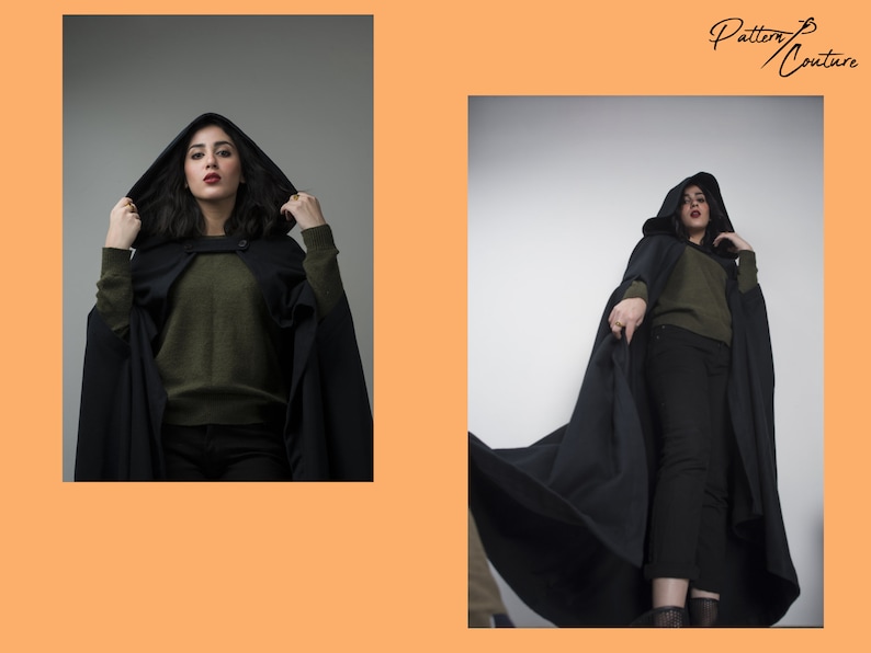 May include: A woman wearing a black hooded cape with a green sweater and black trousers. The cape is long and flowing, and the woman is standing in a studio setting.