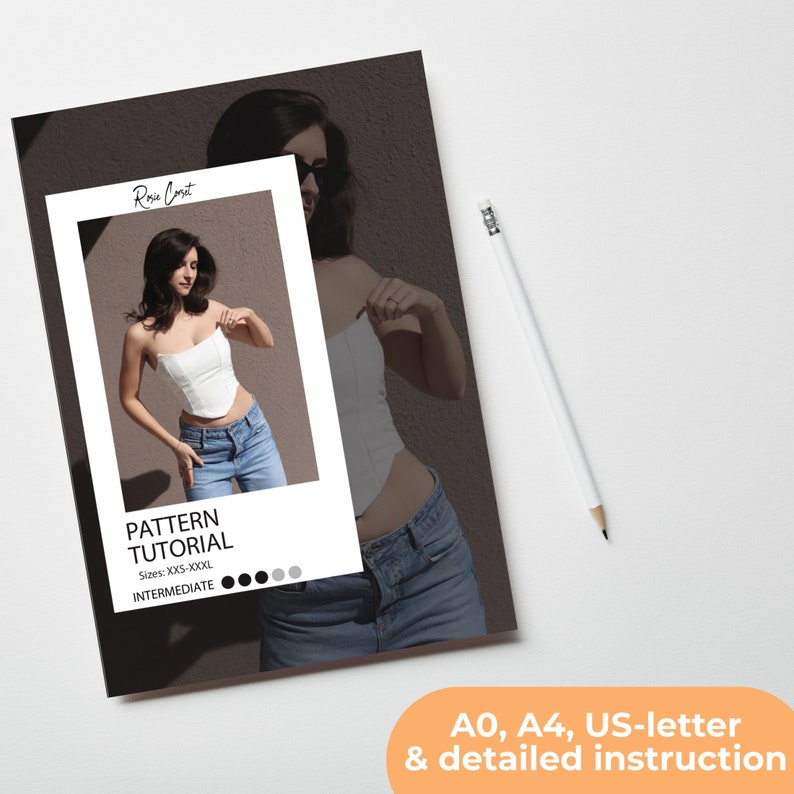 May include: A white corset pattern tutorial with a photo of a woman wearing a white corset and blue jeans. The pattern is available in sizes XXS-XXXL and is considered an intermediate sewing project.