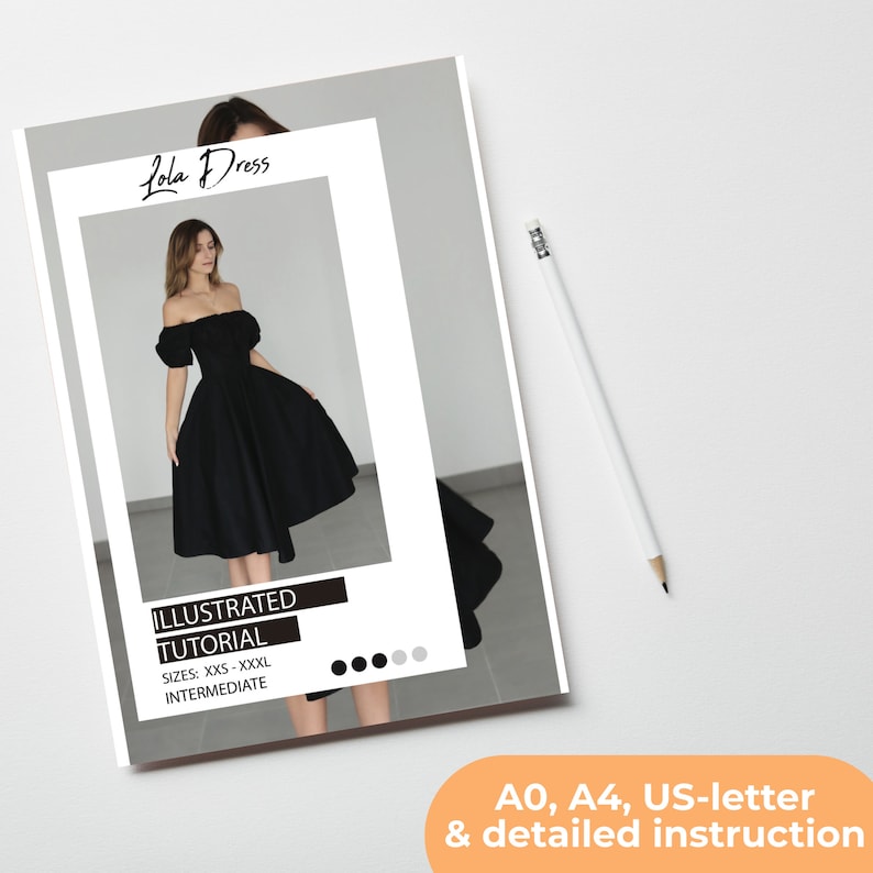 May include: A printed document titled "Lola Dress" with an illustration of a black off-the-shoulder dress. The document includes the text "Illustrated Tutorial" and size information. A white pencil rests on the white surface.
