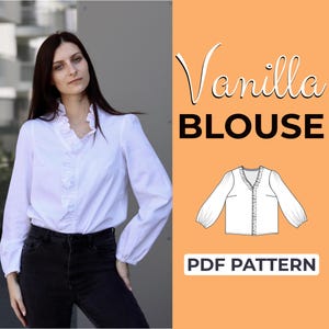 May include: A white blouse with ruffle detailing down the front and long sleeves. The image also includes the text "Vanilla BLOUSE" and "PDF PATTERN". The blouse is paired with black jeans.