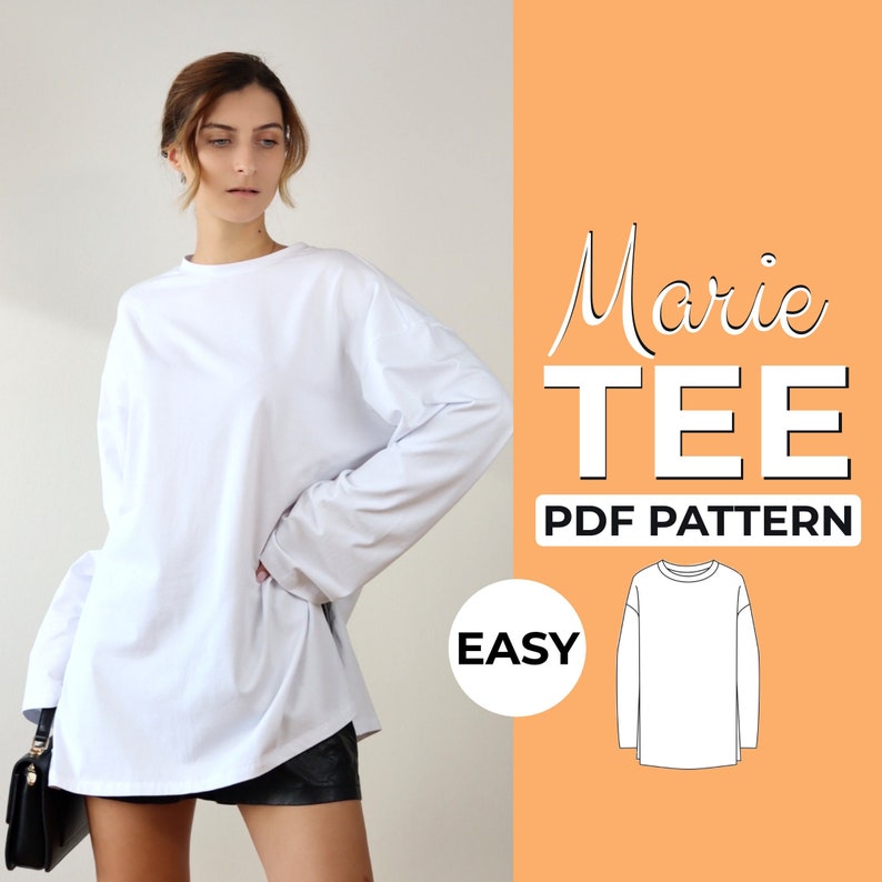 May include: A white long-sleeved t-shirt with a crew neck. The shirt is oversized and has a relaxed fit. The text "Marie TEE PDF PATTERN EASY" is on the right side of the image.