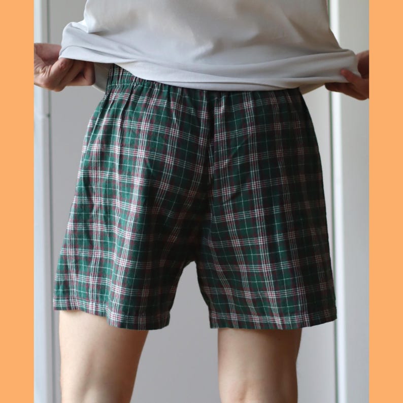 May include: Green and white plaid boxer shorts with a dark green waistband.