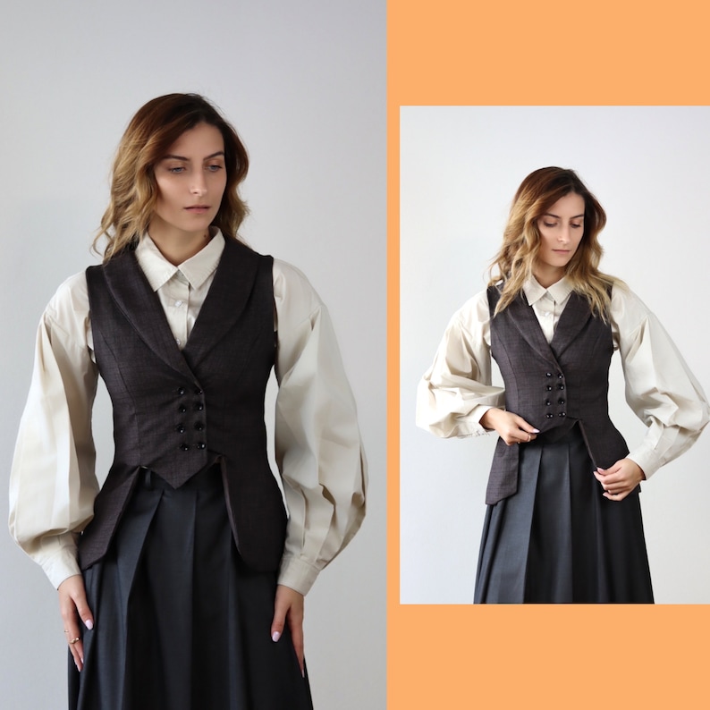 May include: A brown waistcoat with a white button-up shirt underneath. The waistcoat has a double-breasted closure and a pointed collar. The person is wearing a black skirt.