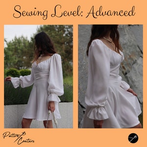 May include: A white dress with a sweetheart neckline and long, puffy sleeves. The dress has a fitted bodice and a flowing skirt. The dress is shown on a model in a natural setting. The text "Sewing Level: Advanced" is displayed at the top of the image.