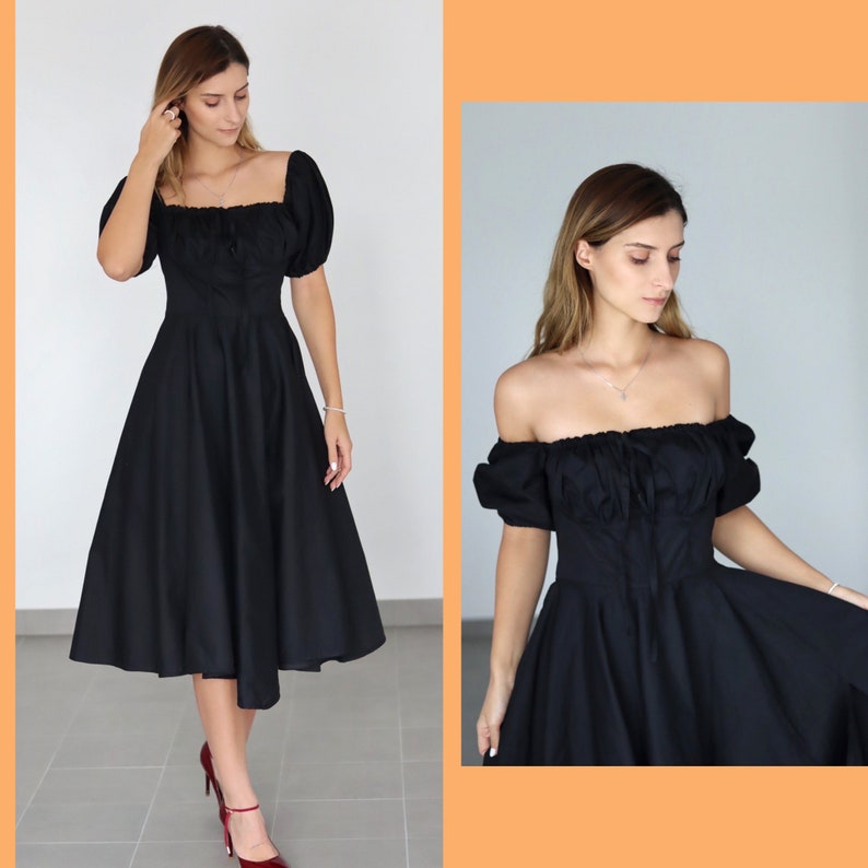 May include: A black midi dress with a square neckline and puffed sleeves. The dress features a fitted bodice and a flared skirt, creating a classic silhouette. The dress is paired with red heels.