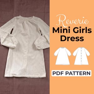 May include: A white long-sleeved dress with a round neckline and gathered sleeves. The image includes the text "Reverie Mini Girls Dress" and "PDF PATTERN" on an orange background, along with dress diagrams.