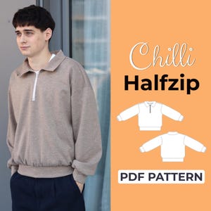 May include: A person wearing a beige half-zip sweatshirt with a white zip and collar. The image includes the text "Chilli Halfzip" and "PDF PATTERN". The sweatshirt has a relaxed fit.