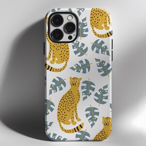 May include: White iPhone case with a repeating pattern of yellow cheetahs and blue tropical leaves.