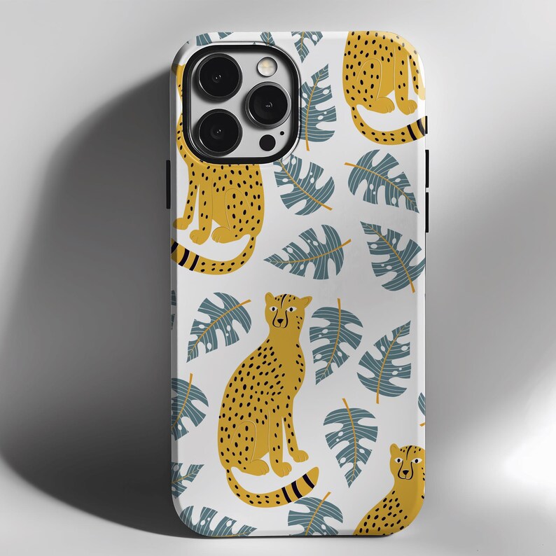May include: White iPhone case with a repeating pattern of yellow cheetahs and blue tropical leaves.