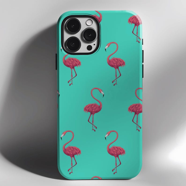 May include: A turquoise phone case with a repeating pattern of pink flamingos. The case has a cutout for the camera lens.