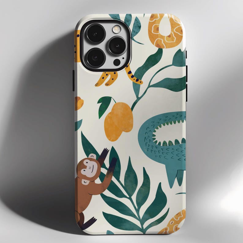 May include: A white phone case with a jungle-themed design. The case features a monkey, a crocodile, a snake, and tropical leaves in shades of green, yellow, and brown.