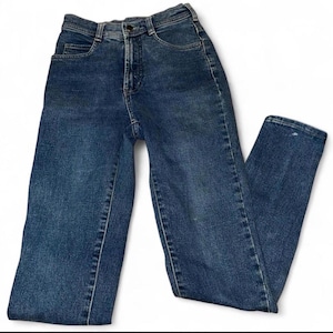 May include: A pair of blue denim jeans with a high waist and straight leg. The jeans have a classic five-pocket design, a button and zipper closure, and belt loops. The denim has a medium wash with some fading and wear.